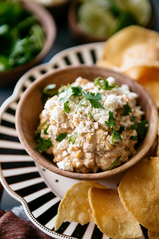 This zesty, elote-inspired dip features charred corn and salty cotija cheese in a creamy lime-infused base, paired perfectly with Vandy Original.