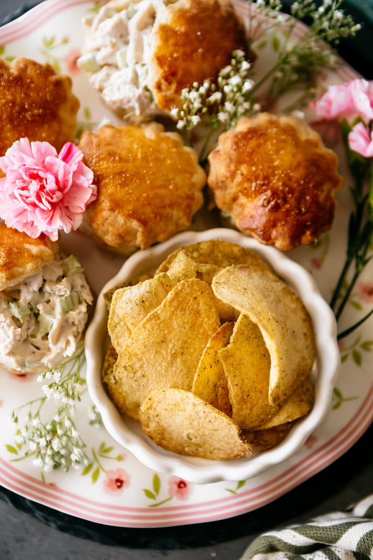 Elegant mini sandwiches featuring creamy lemon-Dijon chicken salad tucked into flaky puff pastry and served alongside Vandy Herbes de Provence.