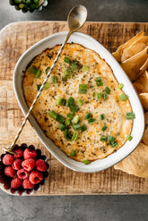 This warm, decadent party dip blends four cheeses with garlic, baked until perfectly molten and served with kettle-cooked french onion potato chips.
