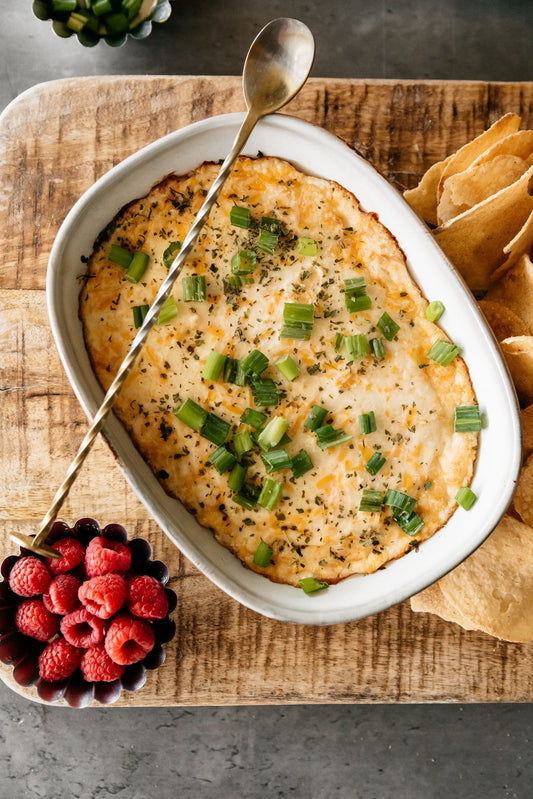 This warm, decadent party dip blends four cheeses with garlic, baked until perfectly molten and served with kettle-cooked french onion potato chips.