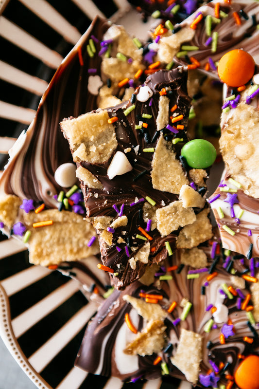 This customizable Halloween dessert features swirled tri-color chocolate topped with colorful festive candies and crunchy, seed-oil-free Vandy Original potato crisps.